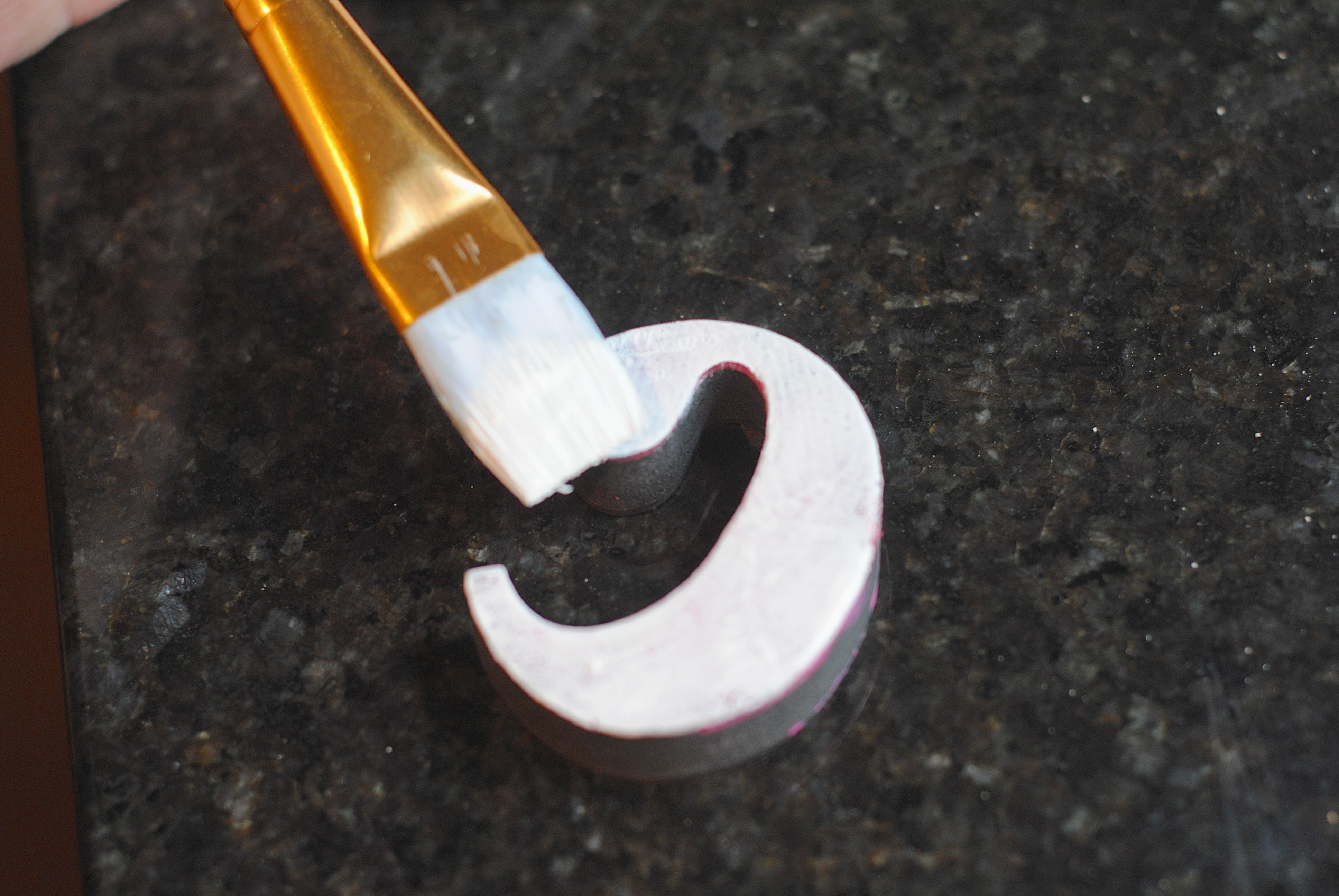 applying paint to a rubber stamp