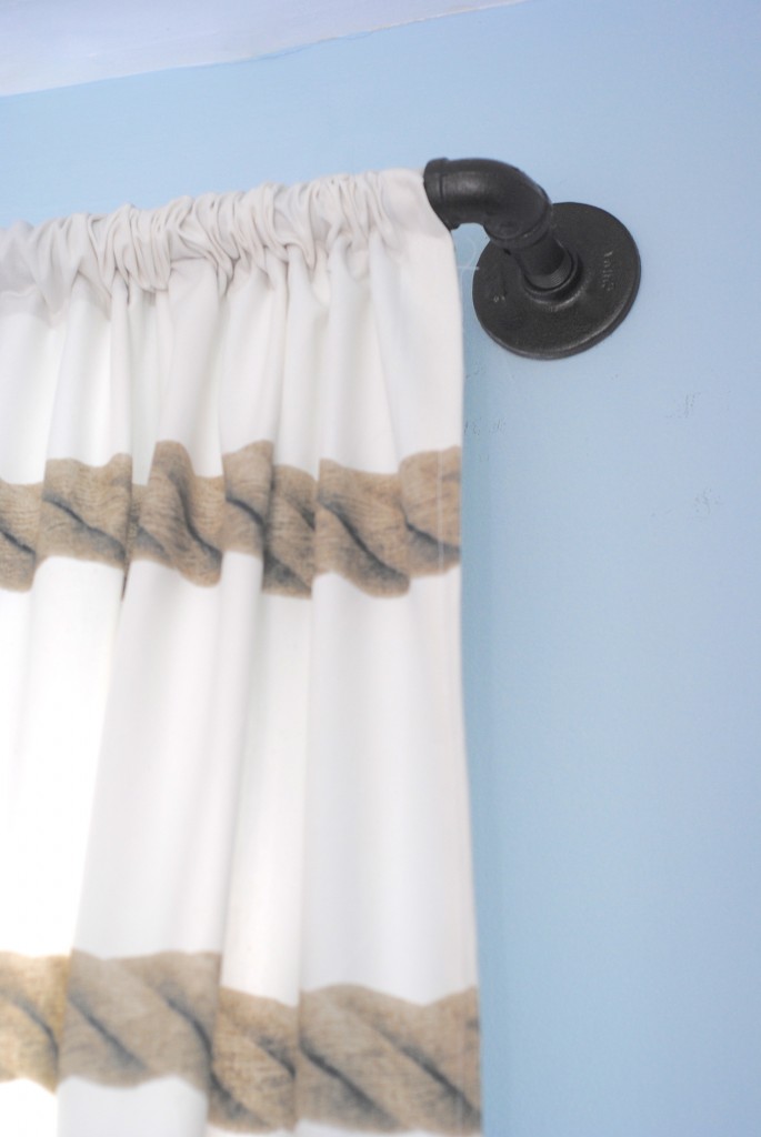 These DIY industrial style pipe curtain rods are a cinch to make, and way cheaper than the West Elm version. Get the tutorial at www.makinglemonadeblog.com! #DIY #knockoff #curtains
