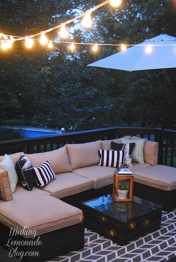LOVE THIS: how to hang outdoor lights! What an easy and inexpensive way to add magic to your deck, patio or party... no pergola or fancy DIY skills needed!