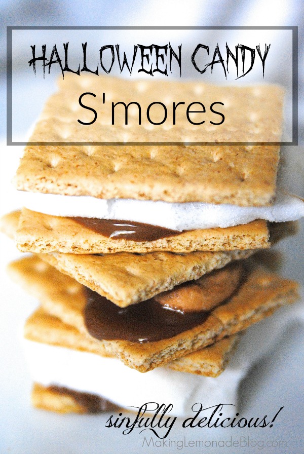 OMG these look so good! Great way to use leftover Halloween candy: Halloween Candy S'Mores with Pumpkin Spice marshmallows!