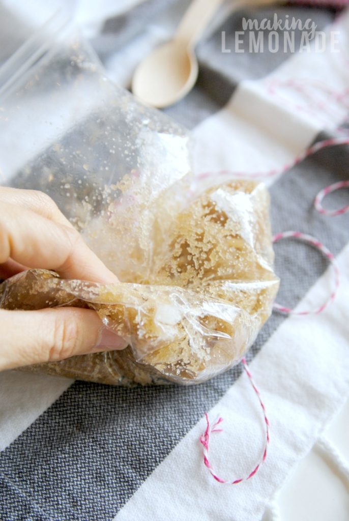 LOVE this handmade holiday DIY gift idea: an essential oil infused hand scrub that's perfect for soothing winter skin!