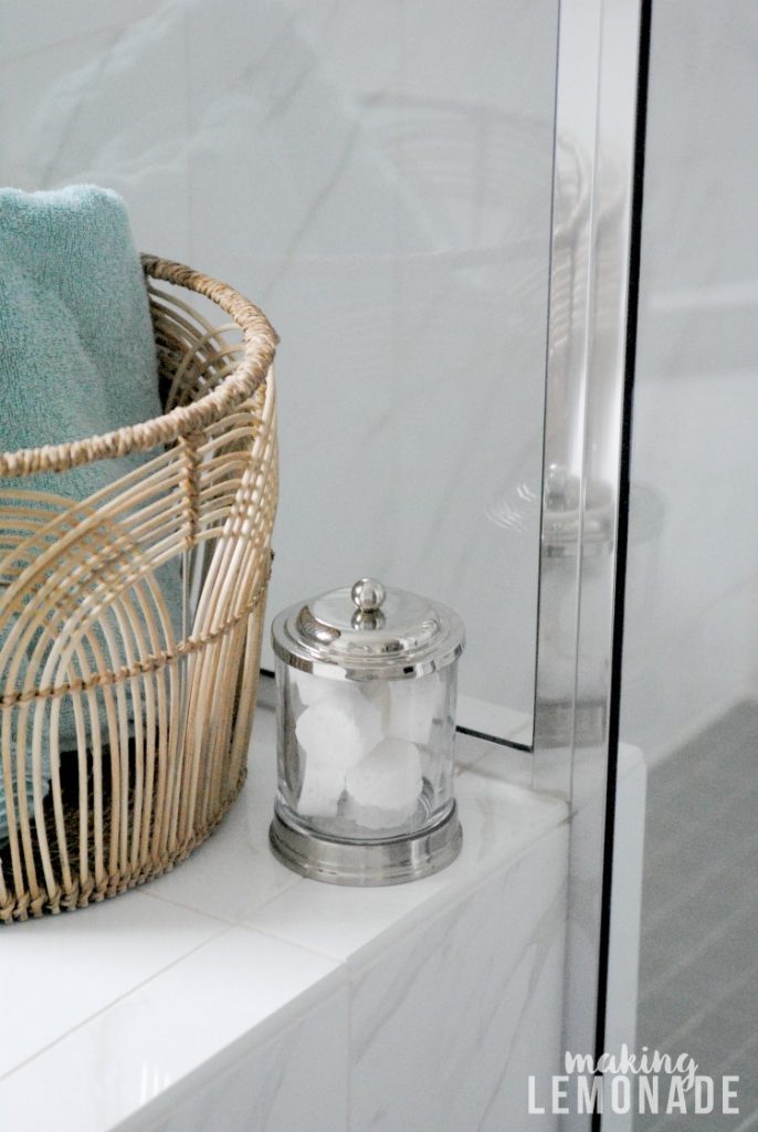 A jar of DIY shower steamers in a bathroom 