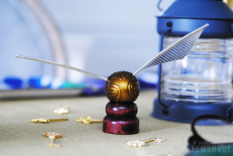 golden snitch on table