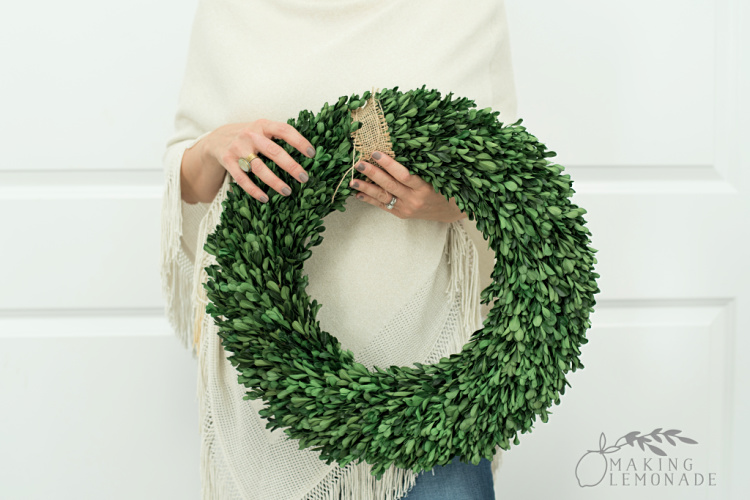 woman holding wreath