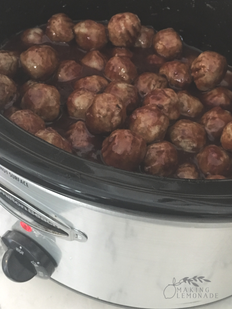 slowcooker with meatballs at party