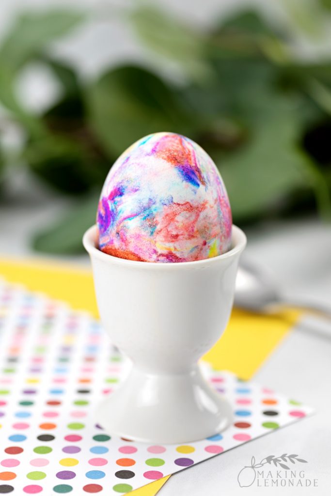 marbled easter egg dyed using shaving cream on Easter table