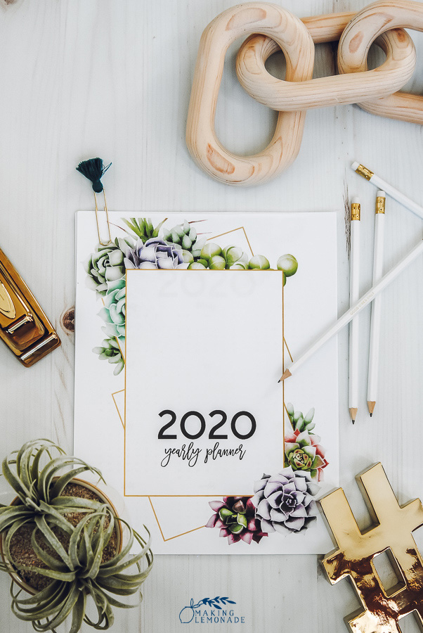 Flatlay 2020 yearly planner on a counter with white pencils