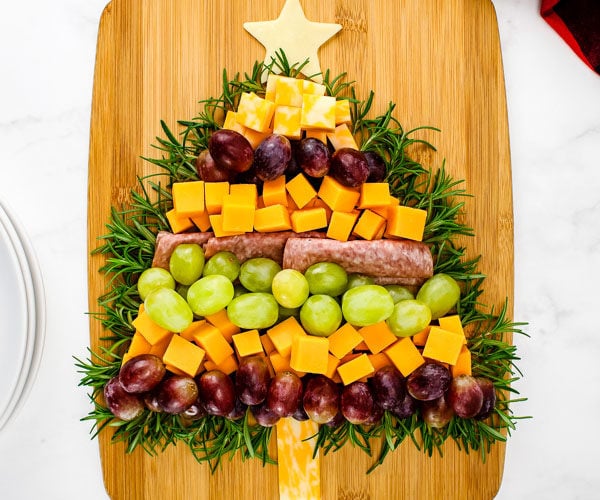 meat and cheese board in the shape of a Christmas tree
