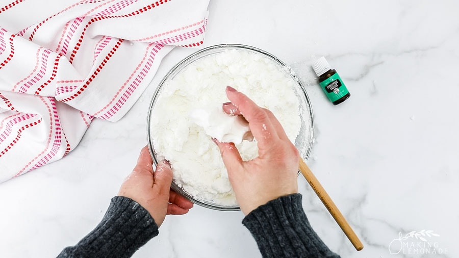 Mixing the ingredients to make DIY shower steamers