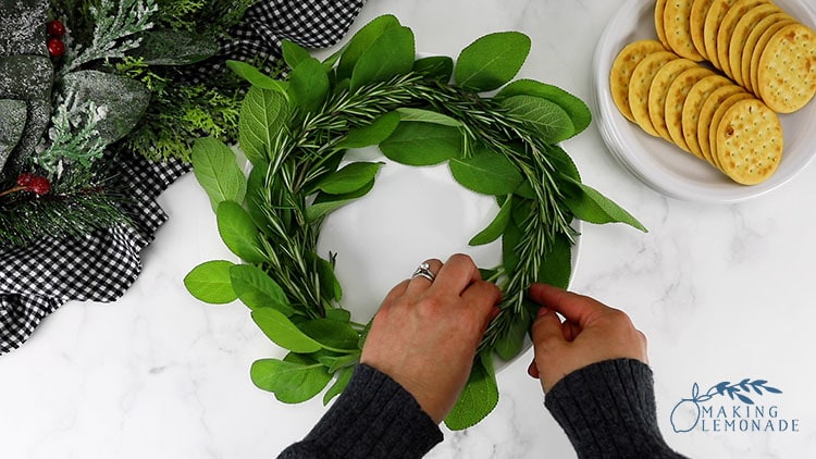 adding greenery to holiday party charcuterie