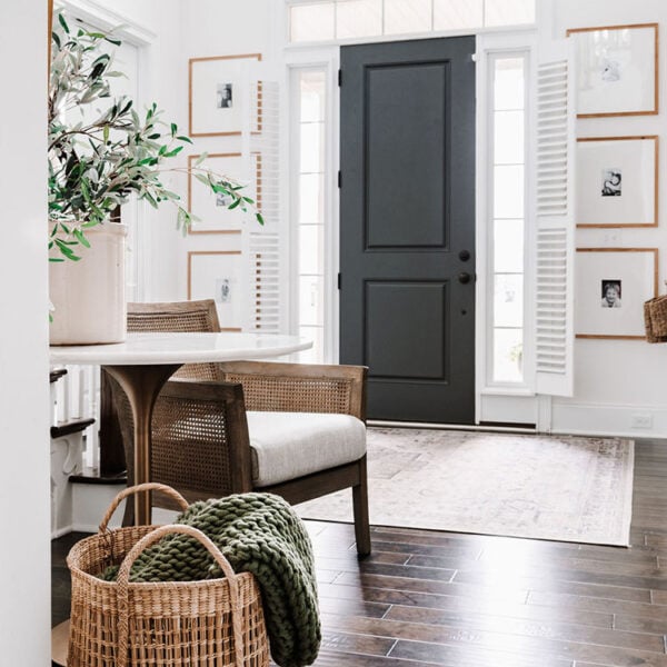 two story entryway with basket and table