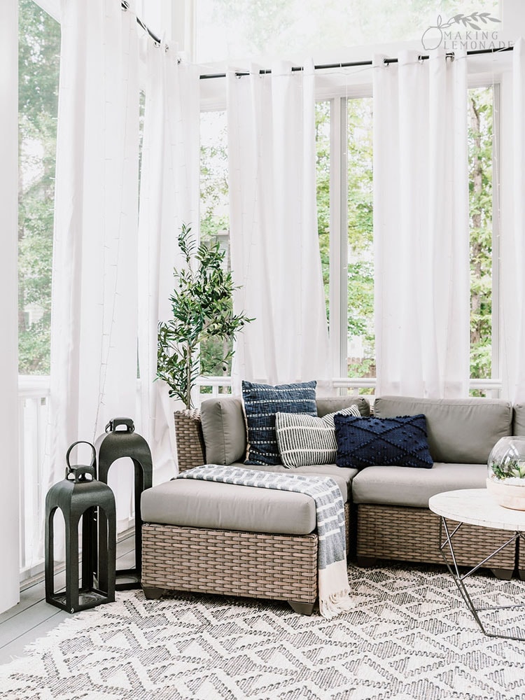outdoor furniture on porch with lanterns