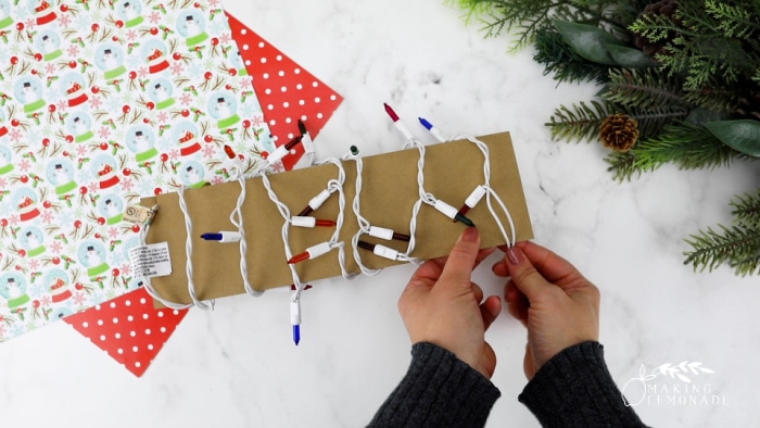 wrapping christmas lights around cardboard