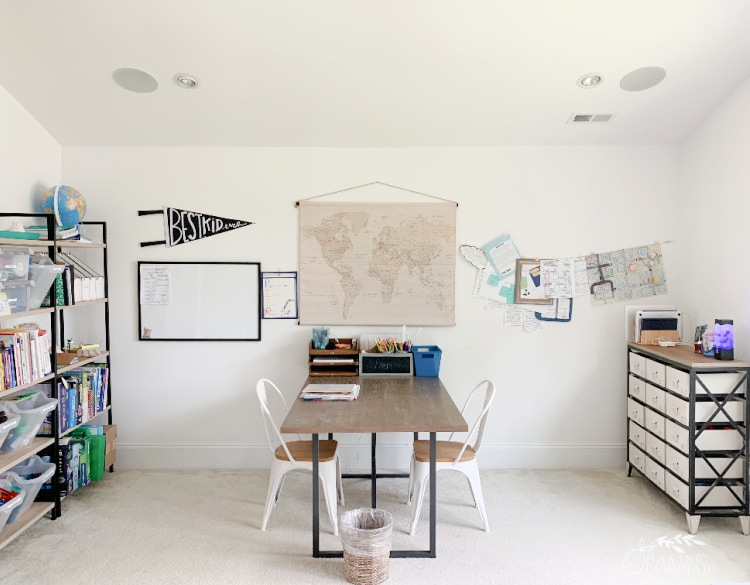 homeschool room with table and bookshelves