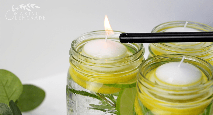 lighting candles in mason jars