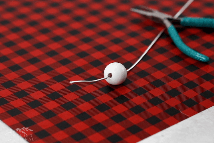 a small bead threaded onto a wire