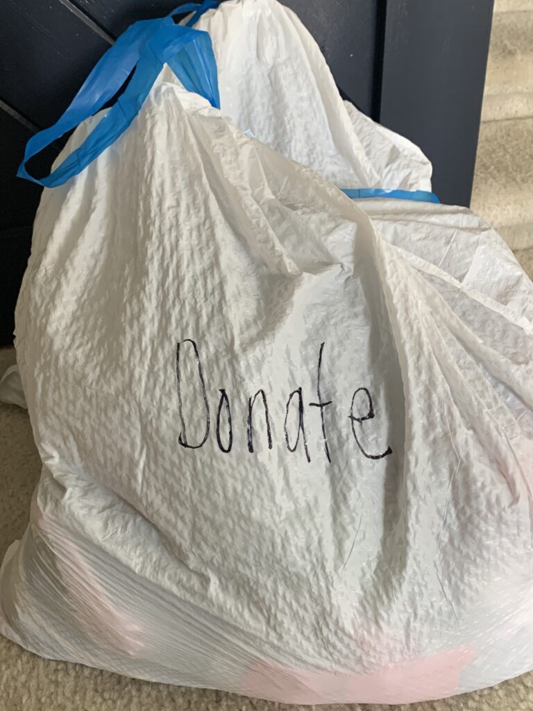trash bag that says donate
