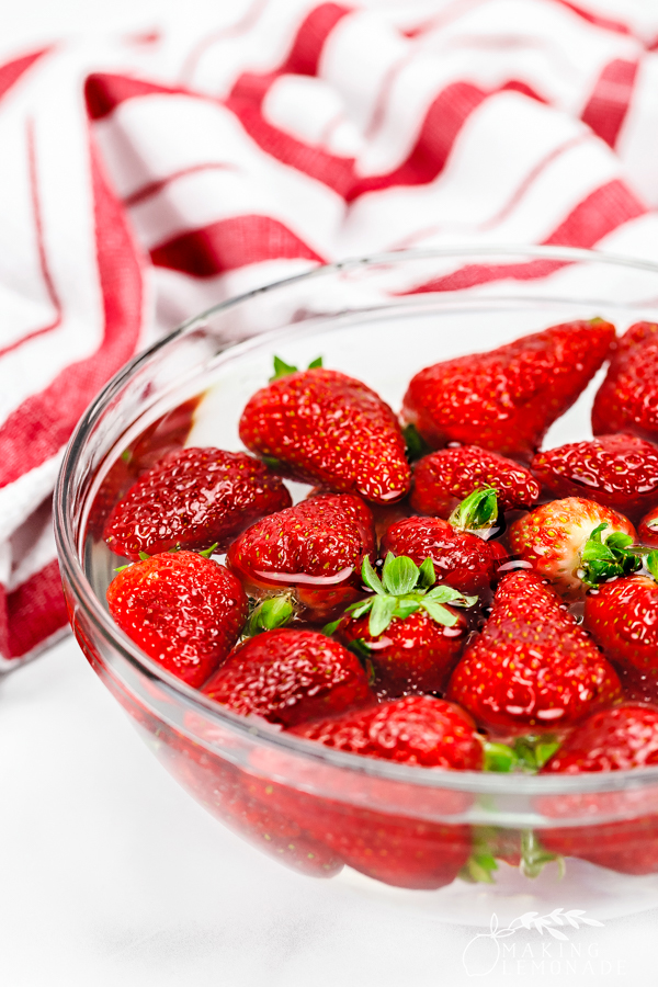 strawberries soaking in vinegar and water