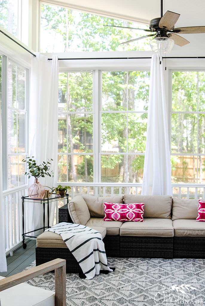 back porch with curtains and sofa