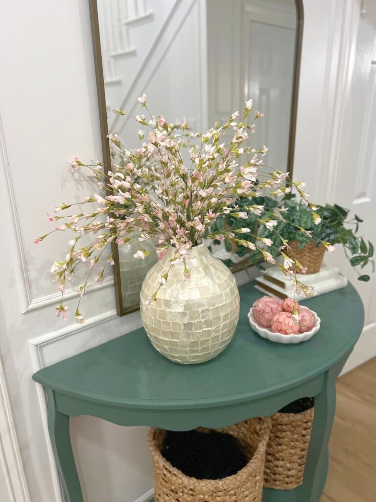 artificial flowers on entryway table 