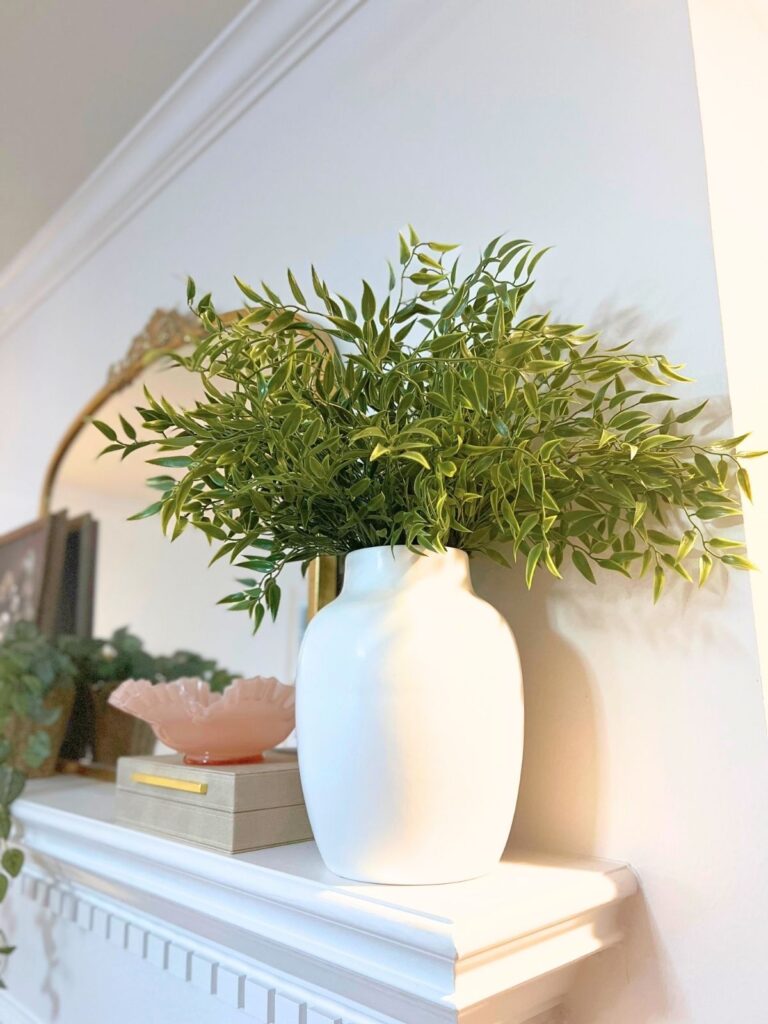 monobotanical faux floral arrangement on fireplace mantle