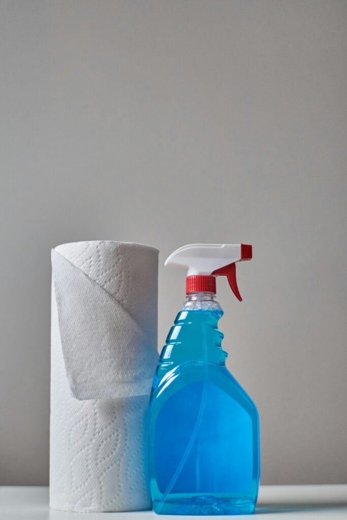 roll of paper towels and spray bottle